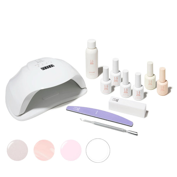 Au Naturel Gel Kit with lamp, bottles, and tools on a white background