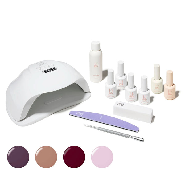 All Things Autumn Gel Kit with lamp, bottles, tools, and colour samples on a white background