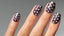 hand with short square nails with glossy brown nails and light blue polka dots