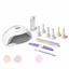 Nail care kit with lamp, nail polish bottles, and other tools on a white background